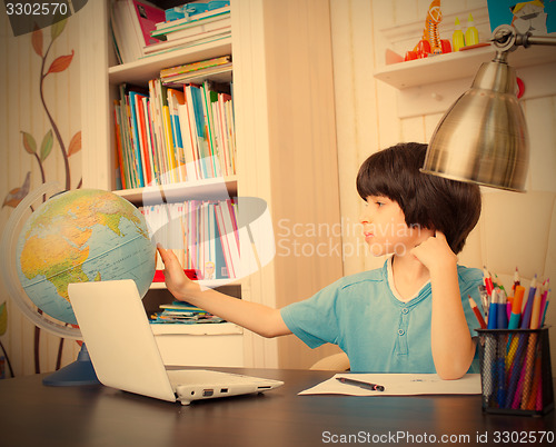 Image of studying geography, boy and globe