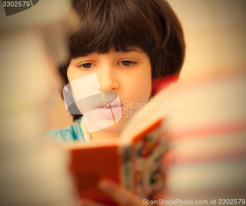 Image of child reading a book