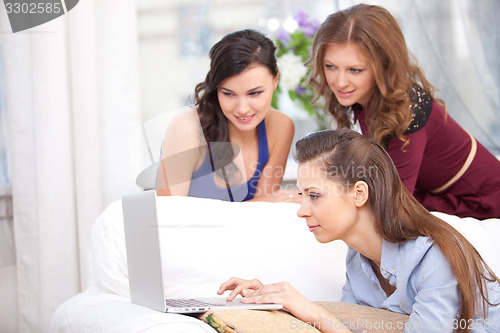 Image of Young girl using a laptop