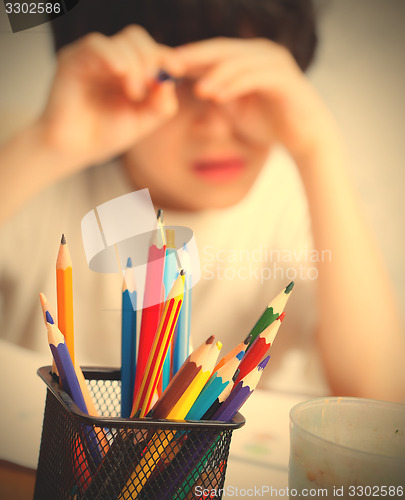 Image of colored pencils to draw in a holder