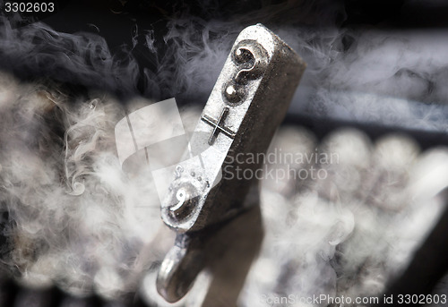 Image of Question mark hammer - old manual typewriter - mystery smoke