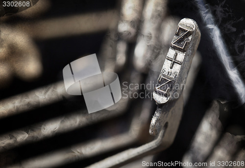 Image of Z hammer - old manual typewriter - mystery smoke