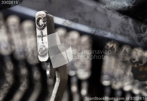 Image of C hammer - old manual typewriter - mystery smoke