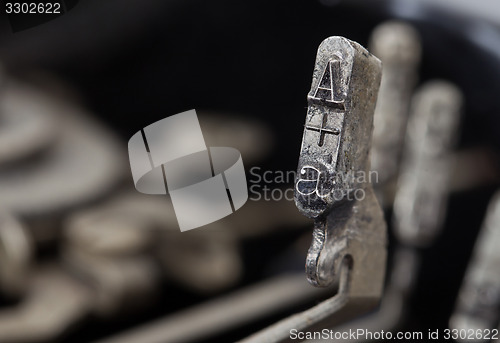 Image of A hammer - old manual typewriter