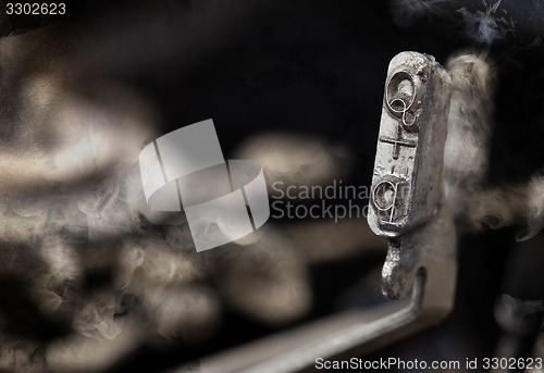 Image of Q hammer - old manual typewriter - mystery smoke