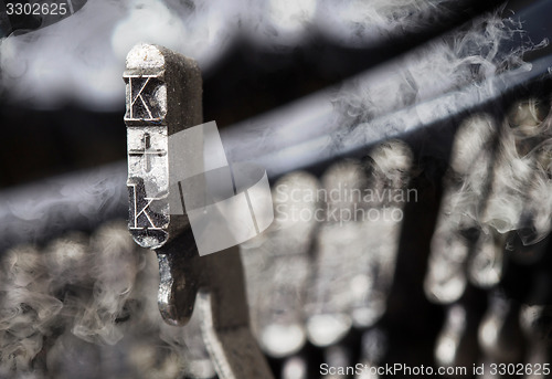 Image of K hammer - old manual typewriter - mystery smoke