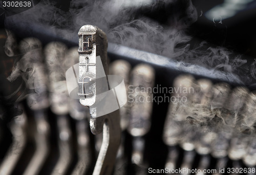 Image of F hammer - old manual typewriter - mystery smoke