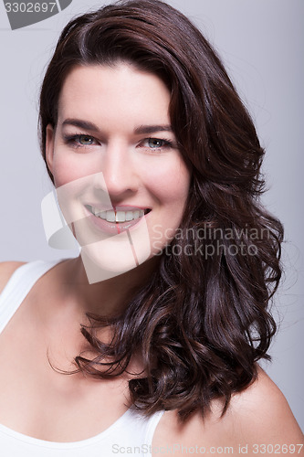 Image of Portrait beautiful woman with dark hair smiling in the camera