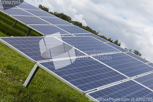 Image of Field with blue siliciom solar cells alternative energy