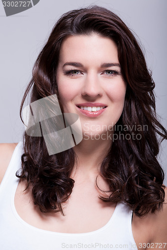 Image of Portrait beautiful woman with dark hair smiling in the camera