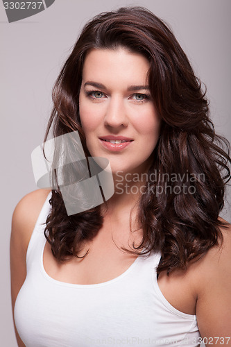 Image of Portrait beautiful woman with dark hair smiling in the camera