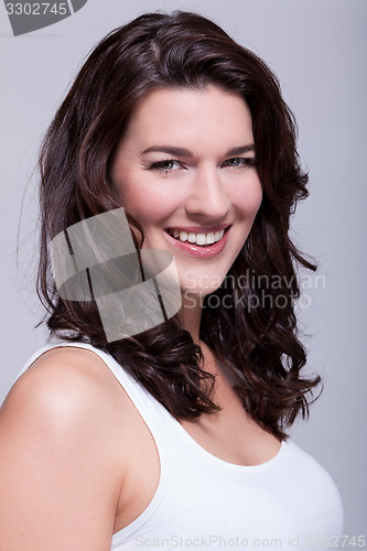 Image of Portrait beautiful woman with dark hair smiling in the camera