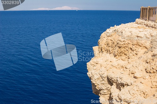 Image of swimmer considers reefs