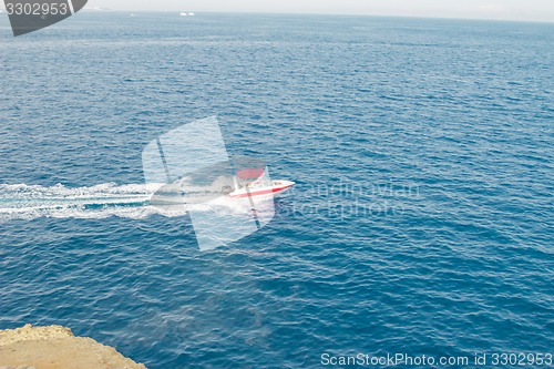 Image of Powerboat racing at high speed in the Red Sea