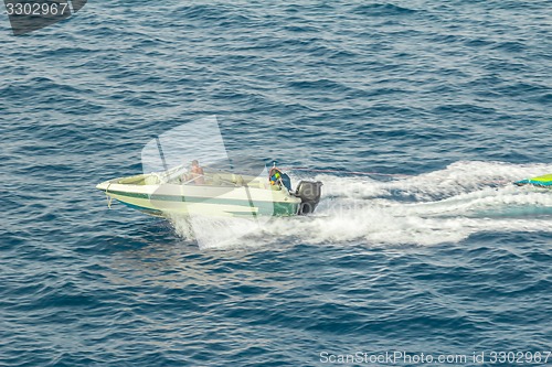 Image of Powerboat racing at high speed in the Red Sea