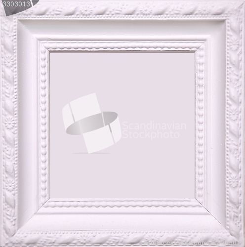 Image of Blank white picture frame on wall