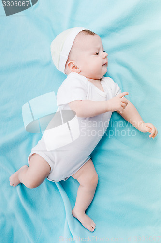 Image of Baby in hat lying