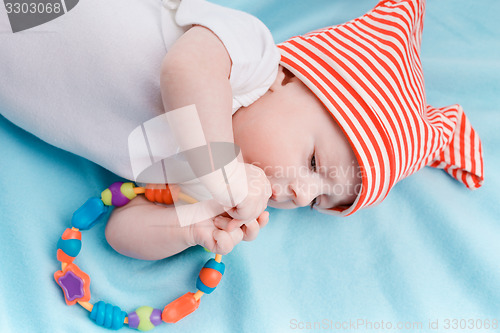 Image of Baby in hat lying