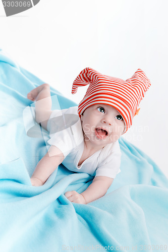 Image of Baby in hat lying