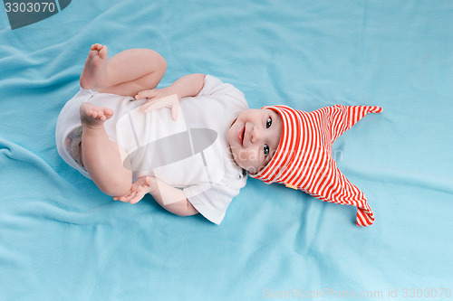 Image of Baby in hat lying