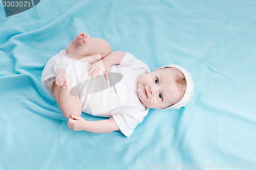 Image of Baby in hat lying