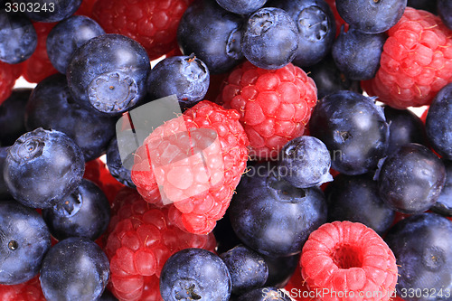 Image of blueberries ad raspberries background