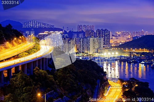Image of highway traffic road to city downtown