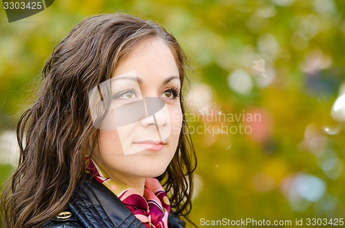 Image of Portrait of a single-minded young girl in autumn clothes