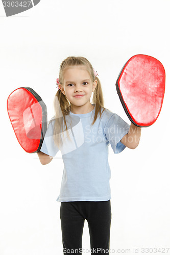 Image of Girl with boxing paws on his hands