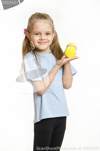 Image of Girl holding a dumbbell