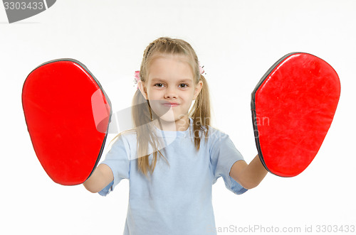 Image of The girl put on hand paws boxing