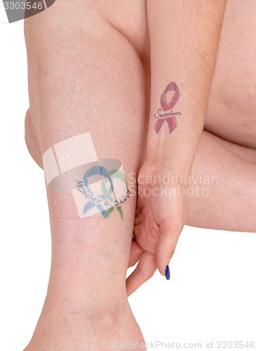 Image of Tattoo on leg and arm.