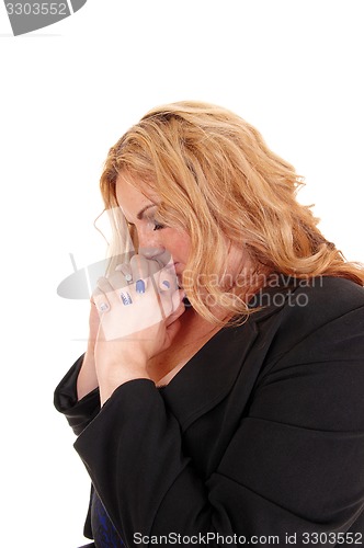 Image of Business woman praying.