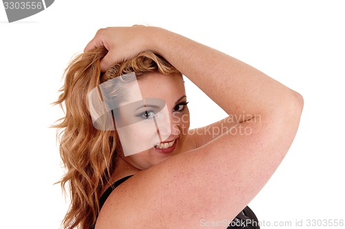 Image of Woman with her hands on head.