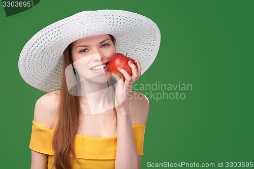 Image of Woman holding red apple