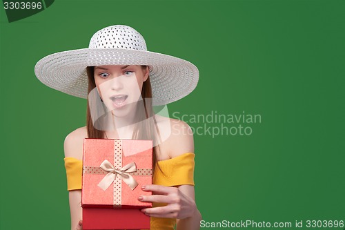 Image of Woman opening gift box