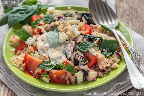 Image of Orzo pasta with tomato, basil.