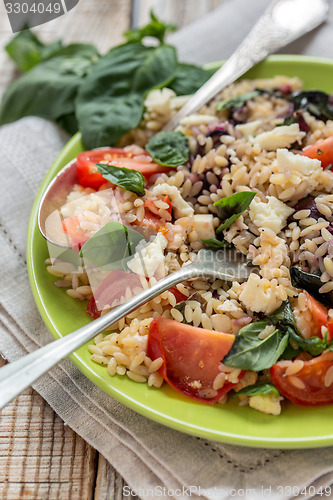 Image of Salad with orzo pasta, basil and feta.