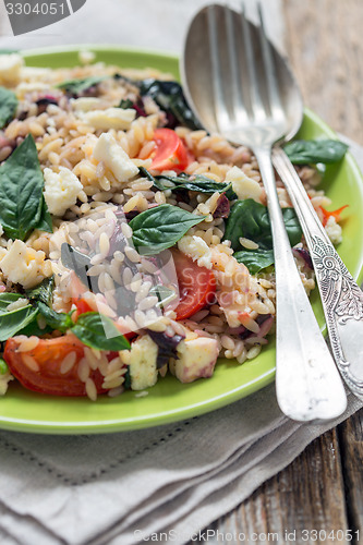 Image of Pasta with cheese, tomatoes and basil.