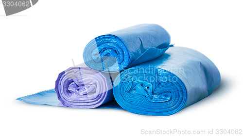 Image of Three rolls of plastic garbage bags rotated
