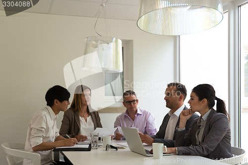 Image of business meeting in a bright environment