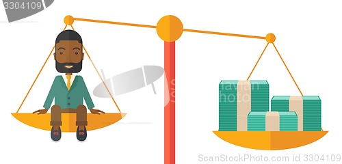 Image of Businessman on a balance scale