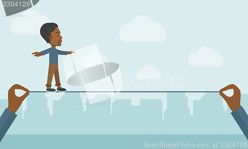 Image of Black Businessman walking on wire.
