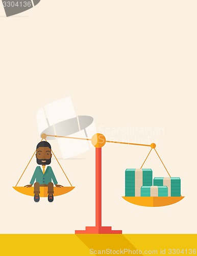 Image of Afircan Businessman on a balance scale