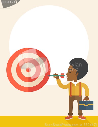 Image of Working black man holding a target arrow 