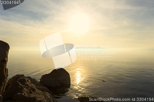 Image of Beach with rocks and a cloudy sky