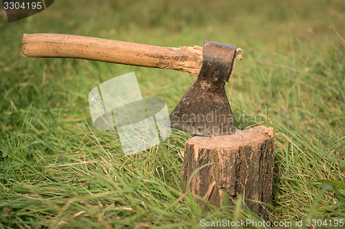 Image of Firewood and old axe