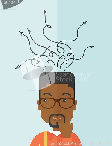 Image of Confused black businessman standing with many arrows.