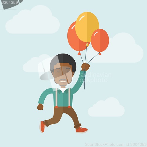 Image of Young black man flying with balloons.