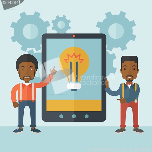 Image of Two businessmen holding big screen tablet.